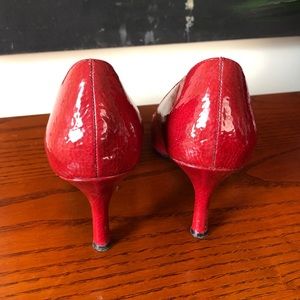 Red patent leather pumps